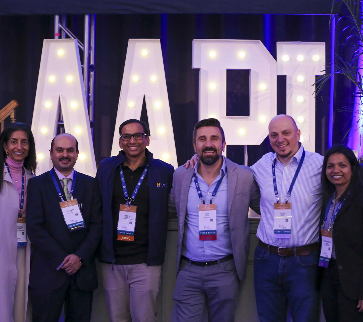 AAPL Annual Leadership Conference attendees in front of the lighted AAPL letters